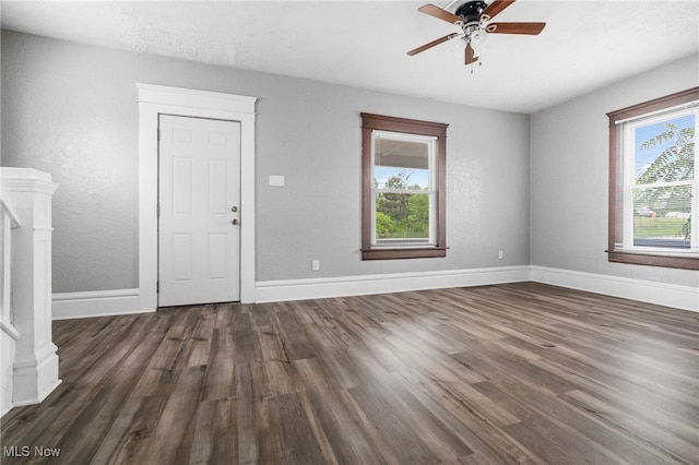 275 Fountain St, Akron, OH 44306 - empty room with dark wood-type flooring, a ceiling fan, and stairway