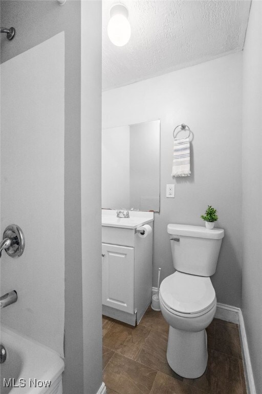 275 Fountain St, Akron, OH 44306 - full bathroom featuring vanity, a textured ceiling, and tub / shower combination