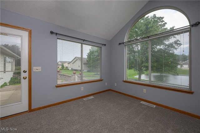 1011 Sequoia Dr NW, Strasburg, OH 44680 - carpeted spare room with lofted ceiling and baseboards