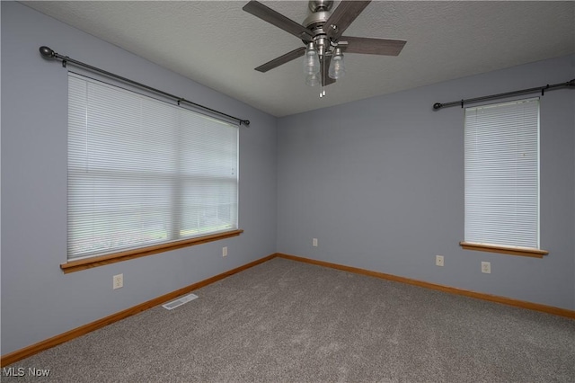 1011 Sequoia Dr NW, Strasburg, OH 44680 - carpeted empty room featuring ceiling fan and a textured ceiling