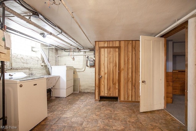 2611 Exeter Rd, Cleveland Heights, OH 44118 - basement featuring washing machine and clothes dryer and wooden walls