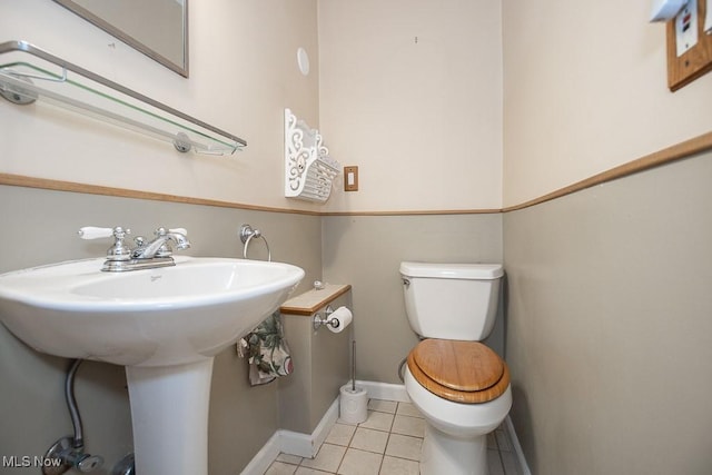 2611 Exeter Rd, Cleveland Heights, OH 44118 - half bathroom with toilet and tile patterned floors