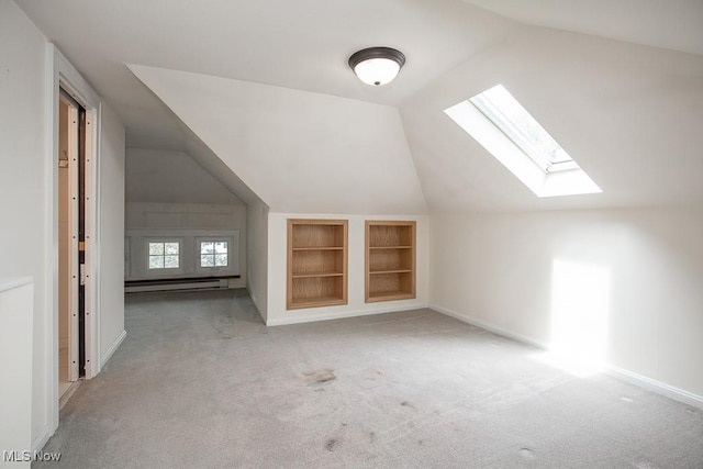 2611 Exeter Rd, Cleveland Heights, OH 44118 - additional living space featuring a skylight, carpet flooring, built in features, lofted ceiling, and a baseboard radiator