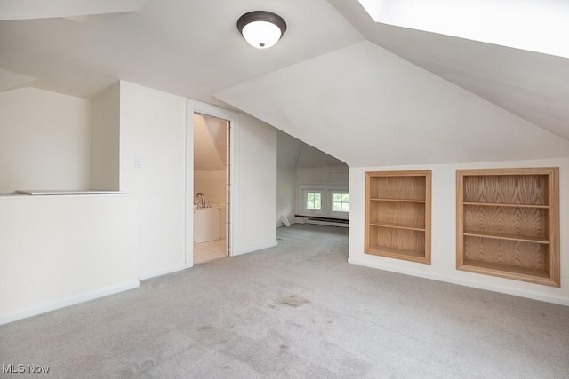 2611 Exeter Rd, Cleveland Heights, OH 44118 - additional living space featuring vaulted ceiling, carpet, built in features, and a baseboard radiator