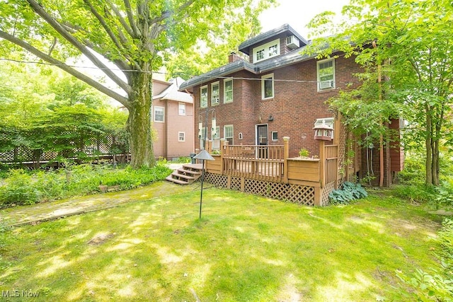 2611 Exeter Rd, Cleveland Heights, OH 44118 - rear view of property featuring a wooden deck, a yard, and brick siding