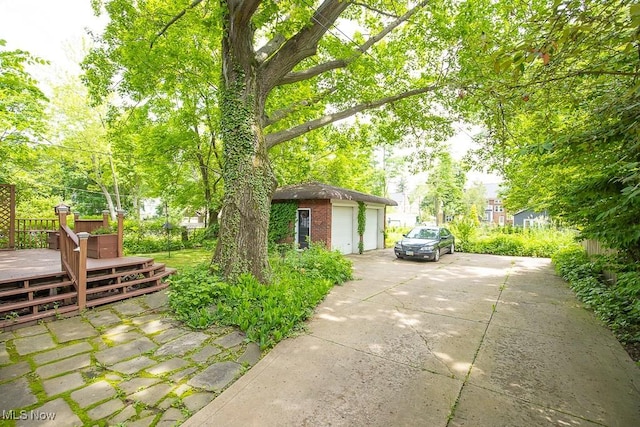 2611 Exeter Rd, Cleveland Heights, OH 44118 - view of yard with a deck, a detached garage, and an outdoor structure