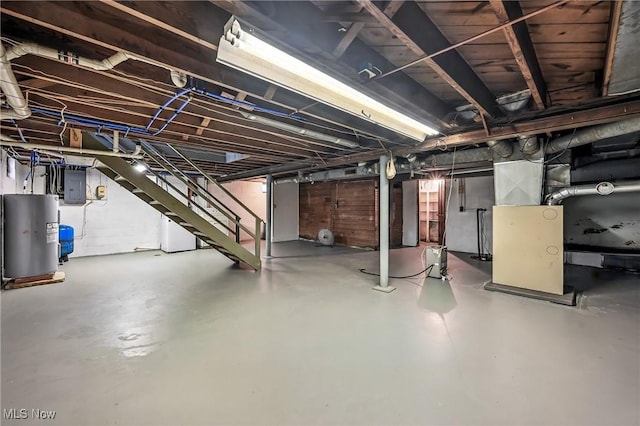 6406 State Route 45, Bristolville, OH 44402 - unfinished below grade area featuring electric panel, water heater, and stairs