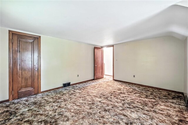 6406 State Route 45, Bristolville, OH 44402 - unfurnished bedroom featuring carpet flooring and vaulted ceiling