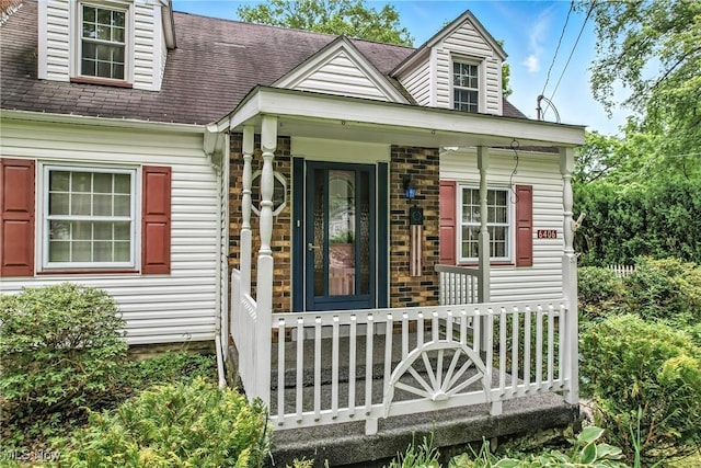 6406 State Route 45, Bristolville, OH 44402 - entrance to property featuring covered porch and a shingled roof