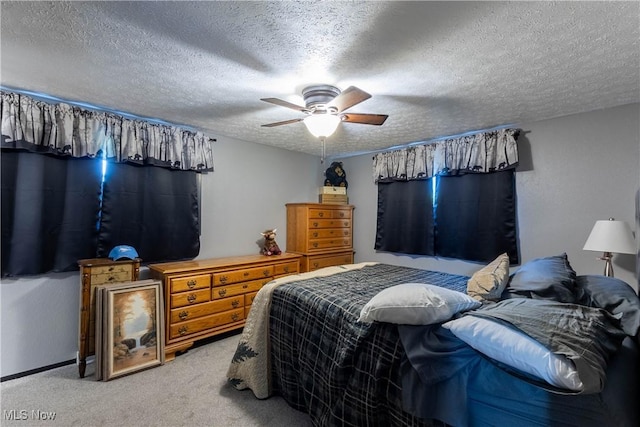 733 Lake Erie St, Conneaut, OH 44030 - bedroom featuring light colored carpet, a textured ceiling, and ceiling fan