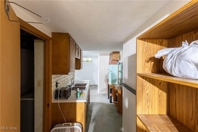 733 Lake Erie St, Conneaut, OH 44030 - kitchen featuring brown cabinets, light countertops, carpet, and decorative backsplash
