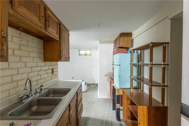 733 Lake Erie St, Conneaut, OH 44030 - kitchen featuring brown cabinets, freestanding refrigerator, concrete flooring, and light countertops