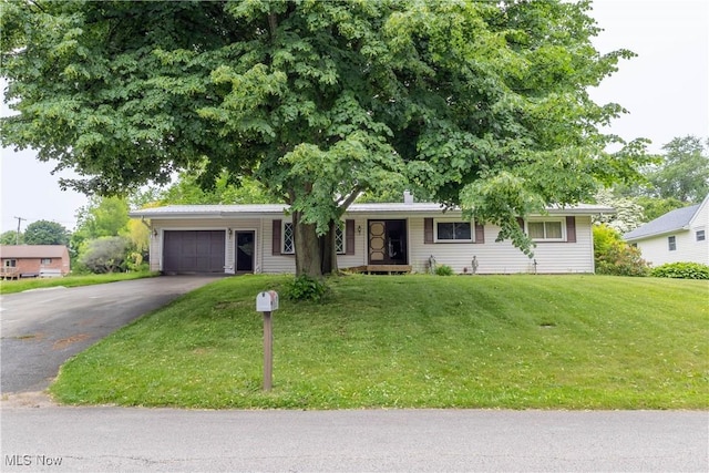 733 Lake Erie St, Conneaut, OH 44030 - ranch-style home featuring driveway, a garage, a front lawn, and covered porch