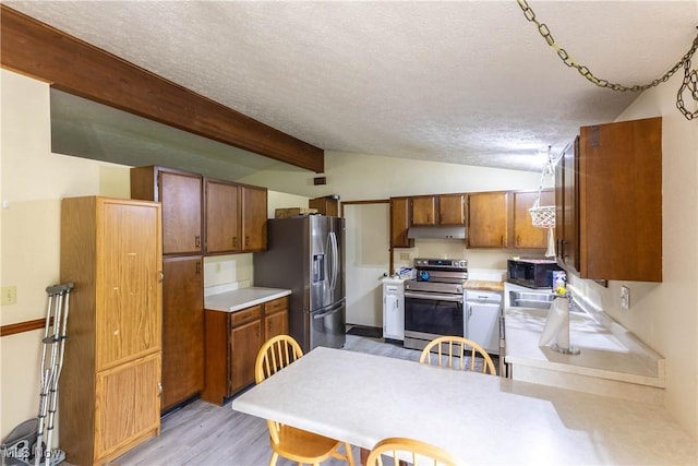 733 Lake Erie St, Conneaut, OH 44030 - kitchen featuring stainless steel appliances, light wood-style floors, under cabinet range hood, a textured ceiling, and light countertops
