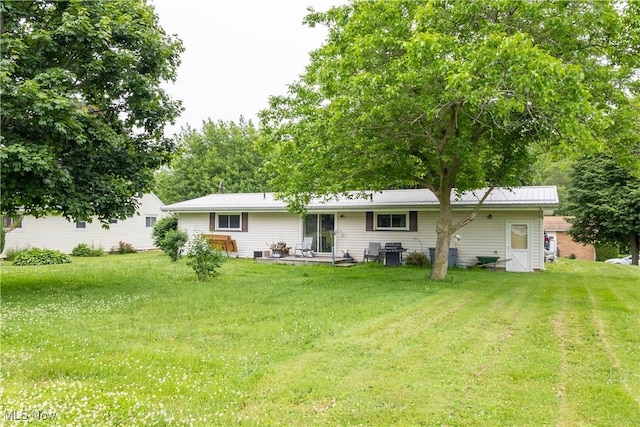 733 Lake Erie St, Conneaut, OH 44030 - back of property with a yard and a patio area