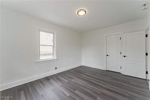 3414 Virginia Ave, Cleveland, OH 44109 - unfurnished bedroom featuring dark wood-type flooring