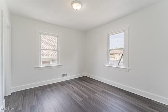 3414 Virginia Ave, Cleveland, OH 44109 - spare room featuring dark wood-style floors and baseboards