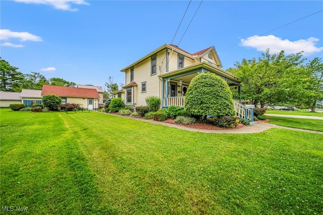 98 W Walnut St, Jefferson, OH 44047 - rear view of property featuring a lawn and a porch