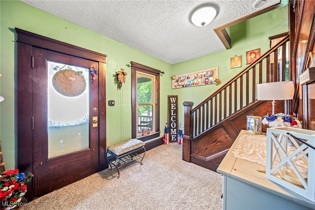 98 W Walnut St, Jefferson, OH 44047 - entrance foyer featuring a textured ceiling, carpet floors, and stairway