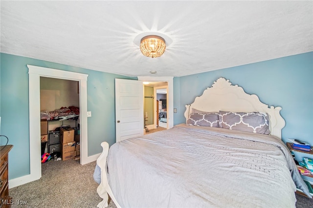 98 W Walnut St, Jefferson, OH 44047 - bedroom featuring carpet floors, a spacious closet, and a chandelier