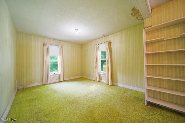 1237 Center St, Ashland, OH 44805 - carpeted empty room featuring baseboards and wallpapered walls