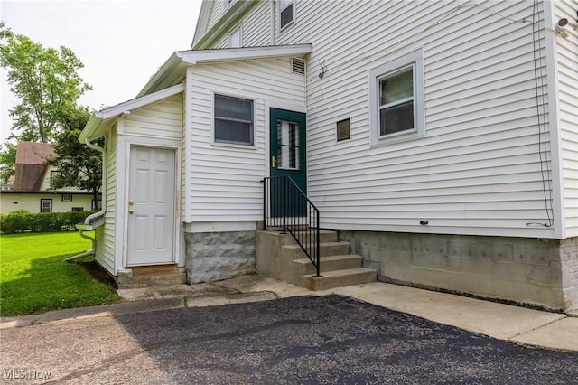 1237 Center St, Ashland, OH 44805 - view of exterior entry featuring a lawn