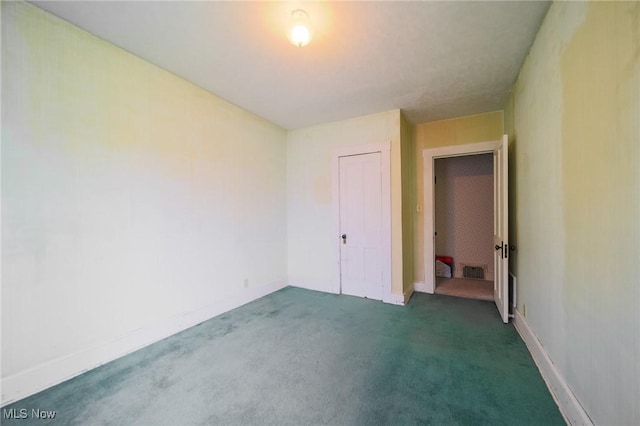 1237 Center St, Ashland, OH 44805 - unfurnished bedroom with dark colored carpet and a closet