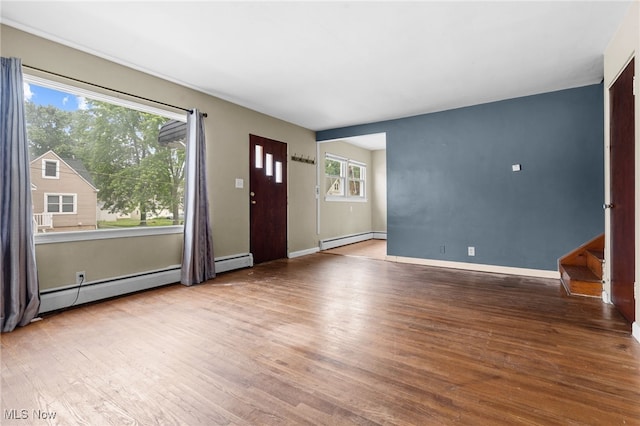 680 Mcgrath St, Alliance, OH 44601 - foyer entrance with a baseboard heating unit and wood finished floors