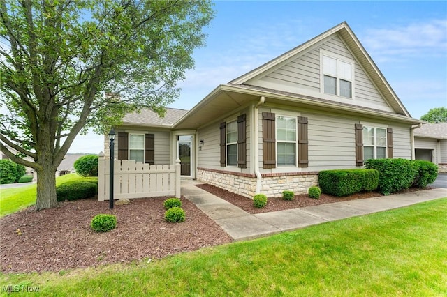 9151 Springfield Rd Unit 1603, Poland, OH 44514 - view of front of home featuring a front yard and a garage