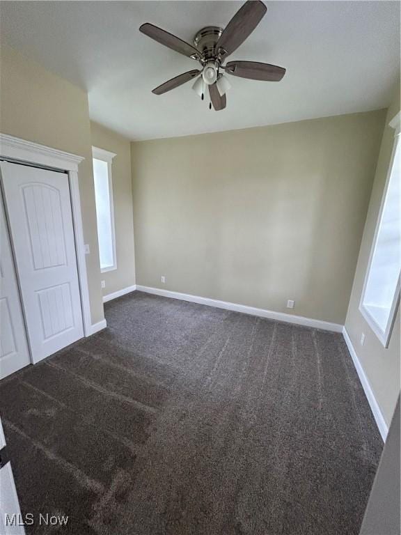 10545 Main St, Norwich, OH 43767 - unfurnished room featuring dark colored carpet and a ceiling fan