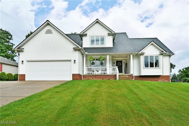 2304 Bianca Ln, Cortland, OH 44410 - view of front of property with a porch, concrete driveway, a shingled roof, a front lawn, and a garage