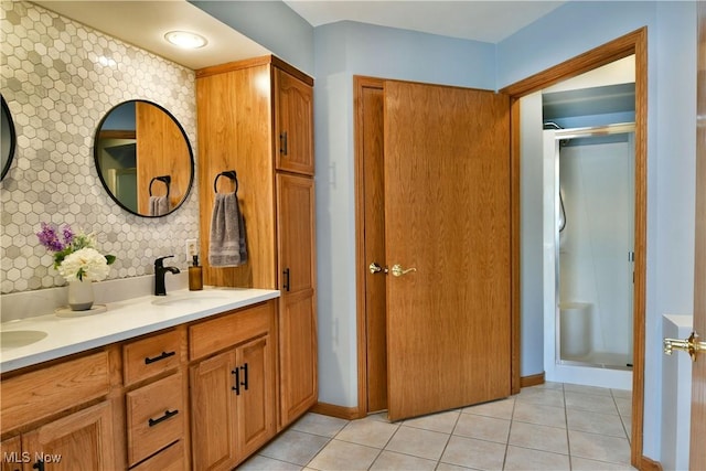 2304 Bianca Ln, Cortland, OH 44410 - full bathroom featuring double vanity, tile patterned floors, and a stall shower