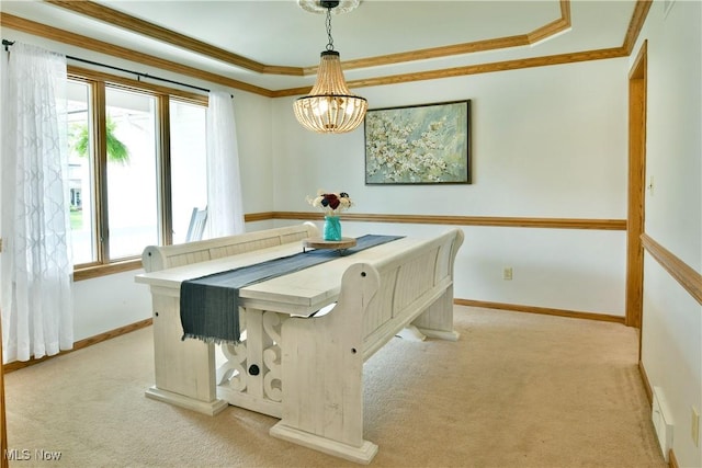 2304 Bianca Ln, Cortland, OH 44410 - dining space with ornamental molding, light carpet, a raised ceiling, and a chandelier