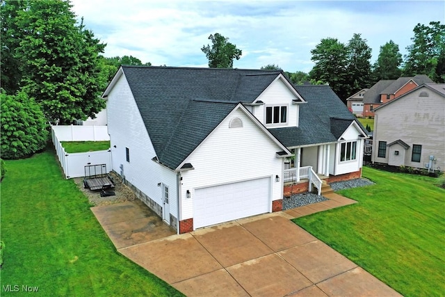 2304 Bianca Ln, Cortland, OH 44410 - view of front of home with roof with shingles, concrete driveway, and a garage
