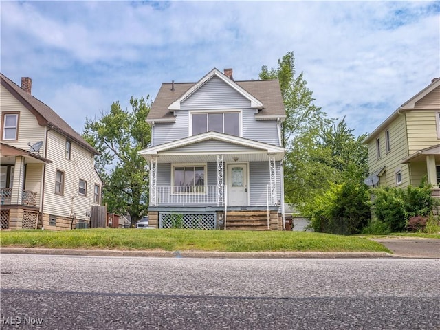 3814 Russell Ave, Parma, OH 44134 - view of front of home with covered porch and a chimney