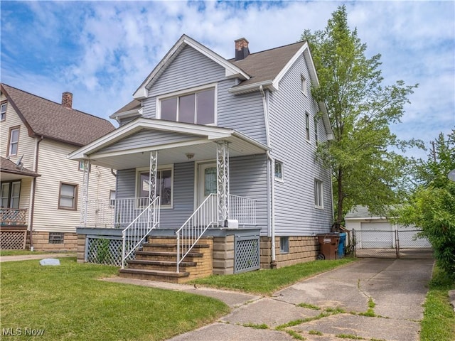 3814 Russell Ave, Parma, OH 44134 - view of front of house with a porch, a front lawn, and a chimney