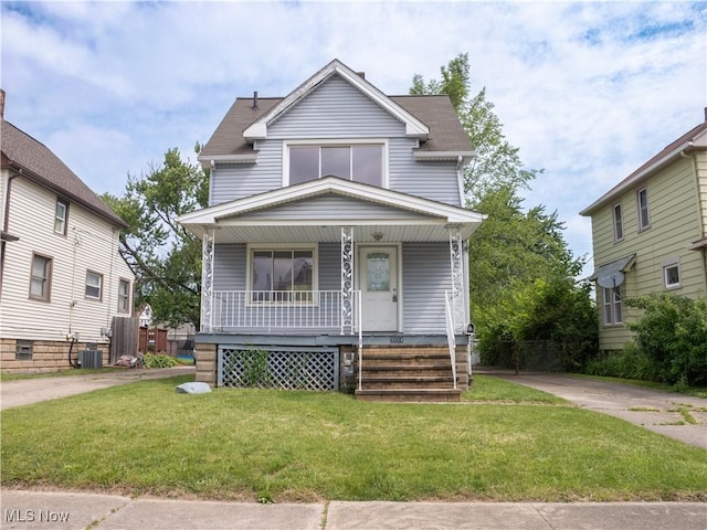 3814 Russell Ave, Parma, OH 44134 - american foursquare style home featuring a porch and a front lawn