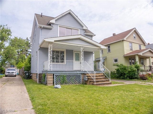 3814 Russell Ave, Parma, OH 44134 - view of front of house featuring covered porch and a front lawn