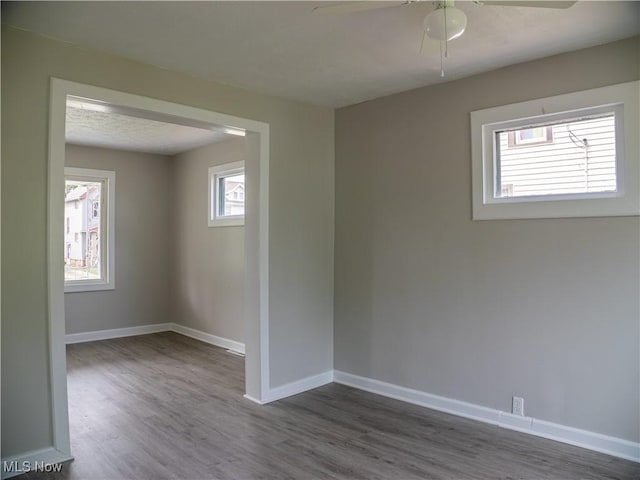 3814 Russell Ave, Parma, OH 44134 - unfurnished room featuring dark wood-style flooring and a ceiling fan