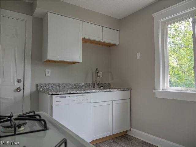 3814 Russell Ave, Parma, OH 44134 - kitchen featuring white dishwasher, plenty of natural light, and white cabinets