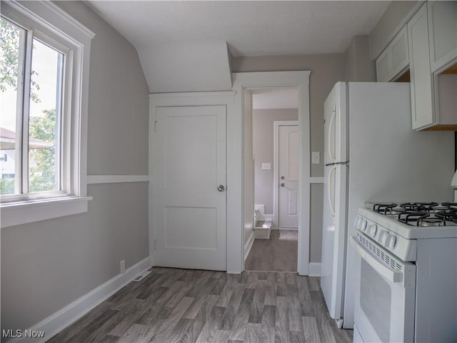 3814 Russell Ave, Parma, OH 44134 - kitchen with white gas range, light wood-style flooring, and light countertops