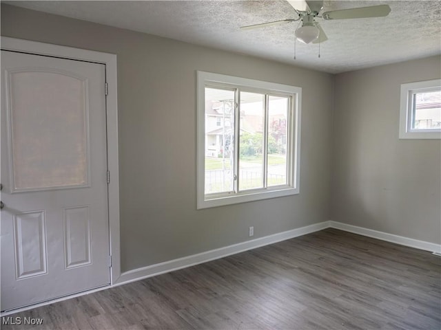 3814 Russell Ave, Parma, OH 44134 - spare room with a textured ceiling, wood finished floors, and a ceiling fan