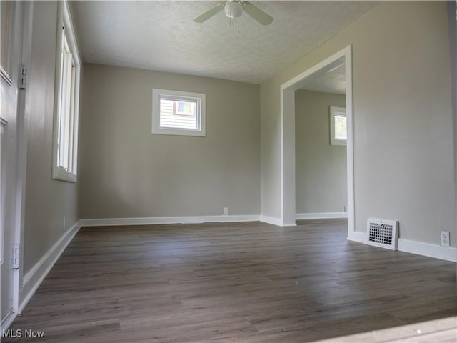 3814 Russell Ave, Parma, OH 44134 - empty room featuring ceiling fan, dark wood finished floors, and a textured ceiling