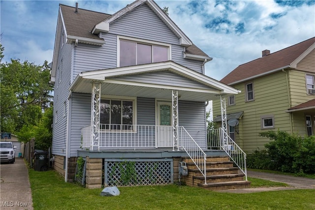3814 Russell Ave, Parma, OH 44134 - view of front of house with a porch and a front lawn