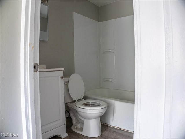 3814 Russell Ave, Parma, OH 44134 - bathroom featuring wood finished floors, vanity, and bathing tub / shower combination