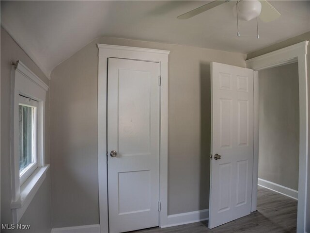 3814 Russell Ave, Parma, OH 44134 - unfurnished bedroom with lofted ceiling, wood finished floors, and ceiling fan