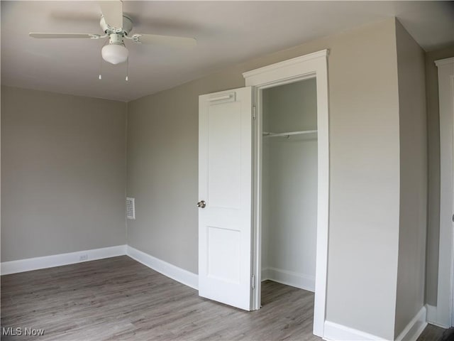 3814 Russell Ave, Parma, OH 44134 - unfurnished bedroom featuring wood finished floors, a closet, and a ceiling fan