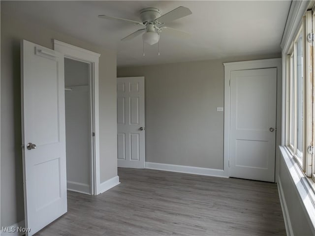 3814 Russell Ave, Parma, OH 44134 - unfurnished bedroom featuring wood finished floors, a closet, and a ceiling fan