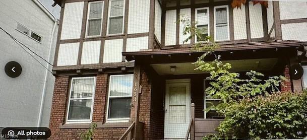 1653 E 118th St, Cleveland, OH 44106 - doorway to property featuring brick siding