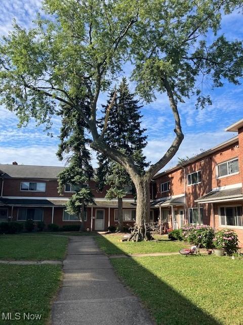4958 Caroline Dr Unit 6, Warrensville Heights, OH 44128 - view of front of house featuring a front yard